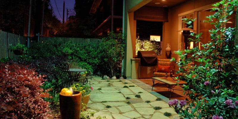 A home in Houston, TX, with landscape lighting